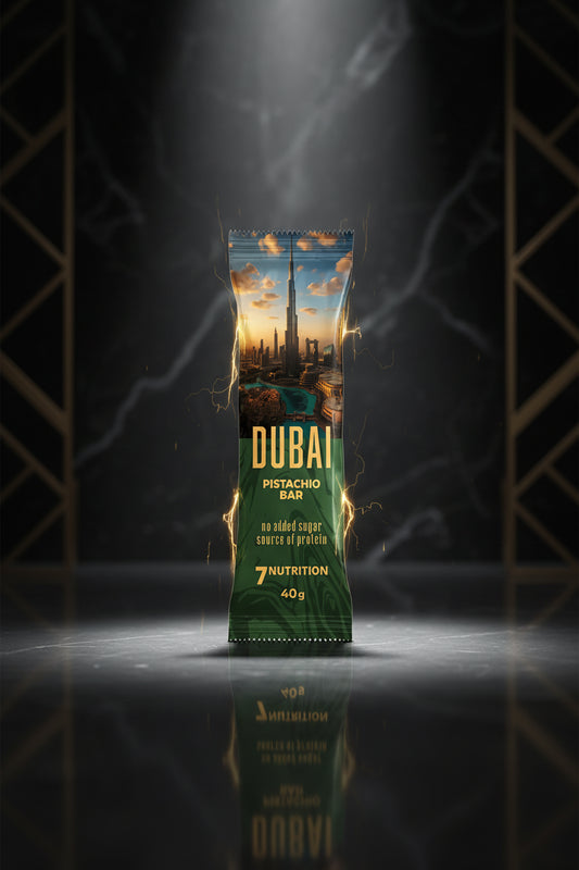 Barra de pistache Dubai Bar 40g da 7 Nutrition, enchimento de pistache com chocolate, embalagem dourada e detalhes dourados.