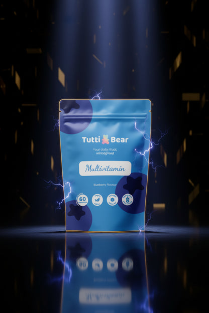 Gomas multivitamínicas tutti Bear em embalagem com várias gomas coloridas e saborosas, para suplementação de vitaminas.